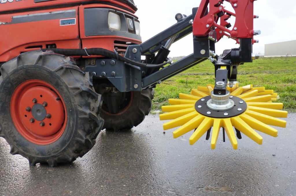 Finger weeders in front of Kubota