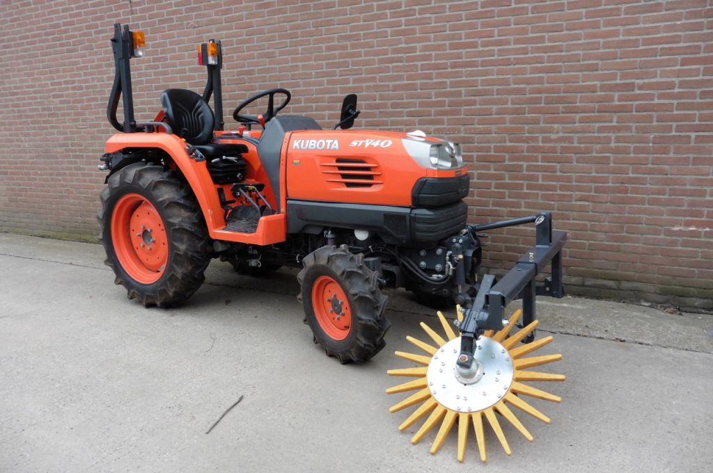 Finger weeders in front of Kubota