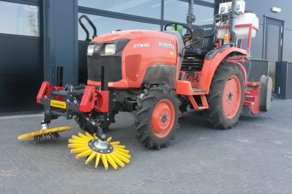 Finger weeders in front of Kubota