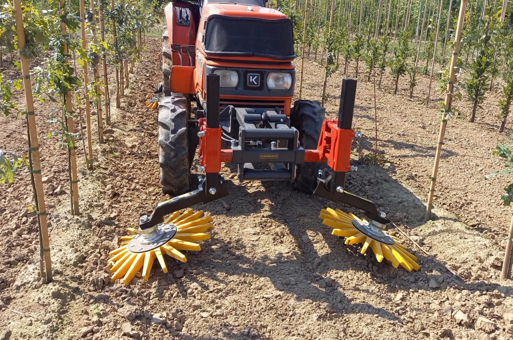 Finger weeders in front of Kubota
