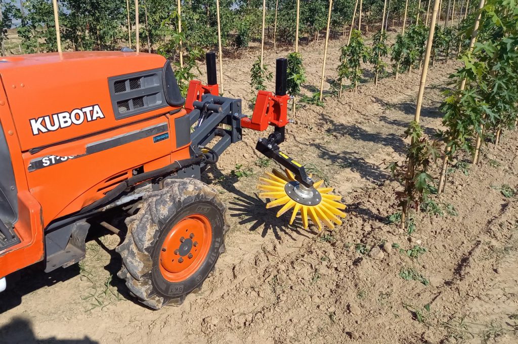 Finger weeders in front of Kubota