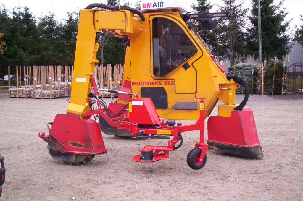 Saw unit at trunk pruner - Multitrike high clearance tractor for christmas trees