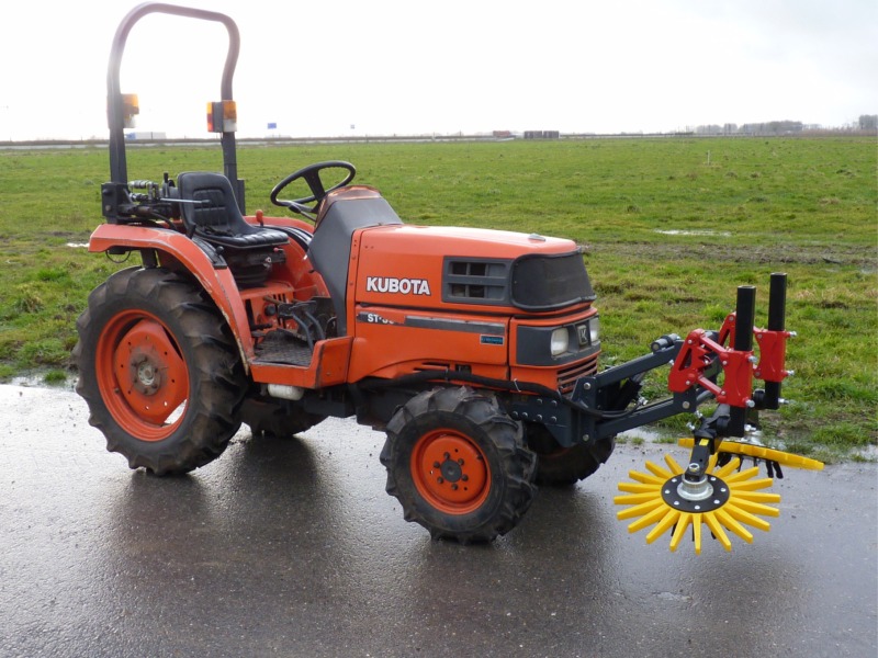Finger weeders in front of Kubota