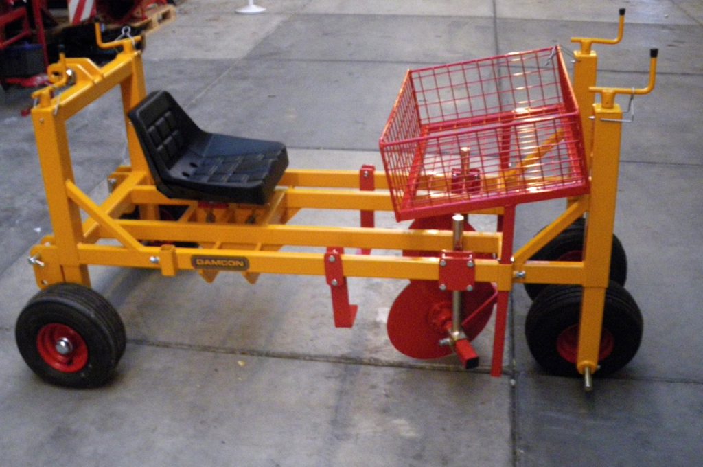 Plant storage box mounted above planting trench